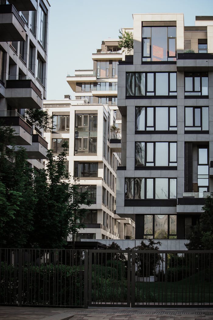 A view of contemporary buildings with minimalist design in an urban setting.